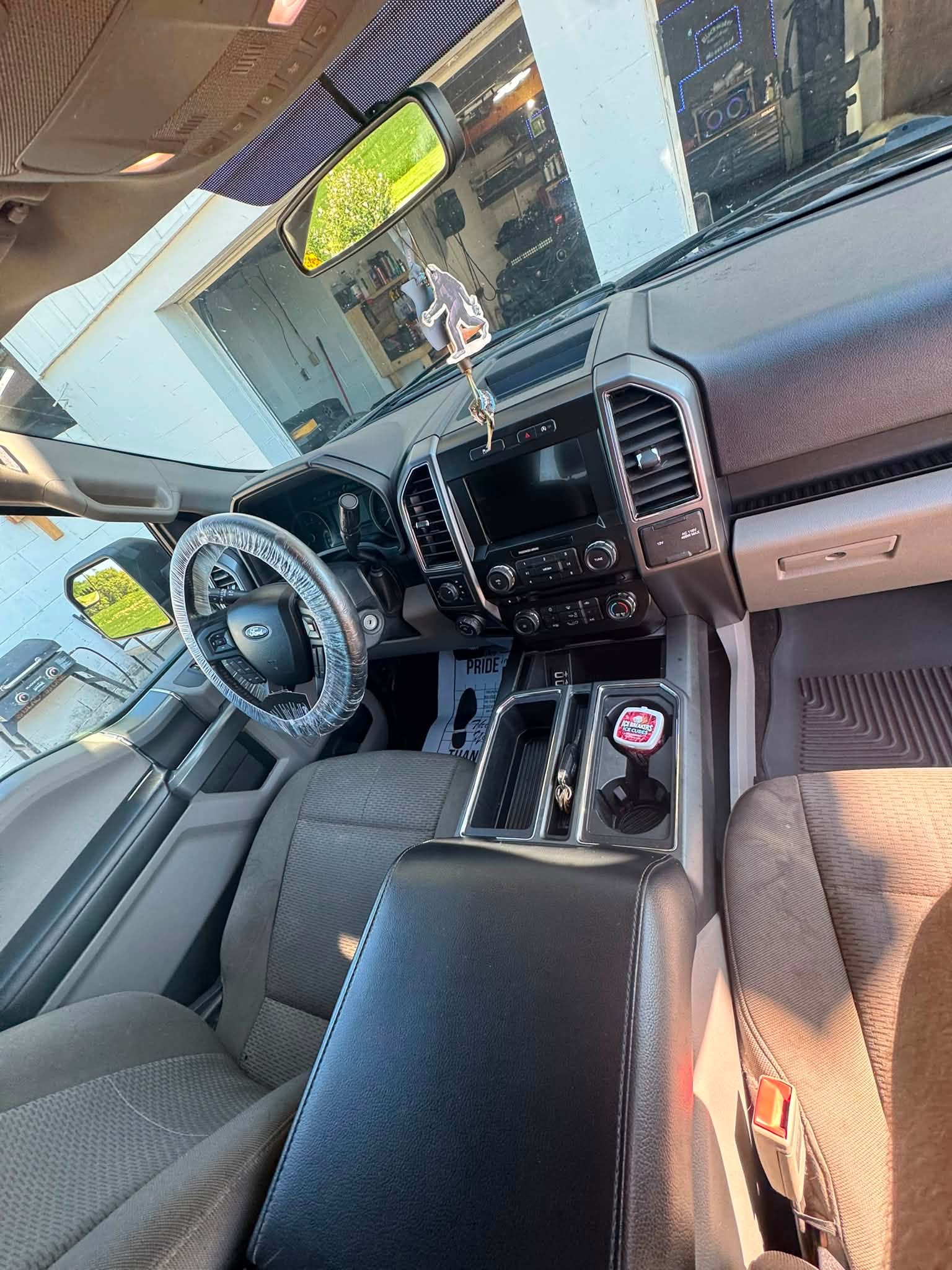 Detailed dashboard, console and shifter area of a truck
