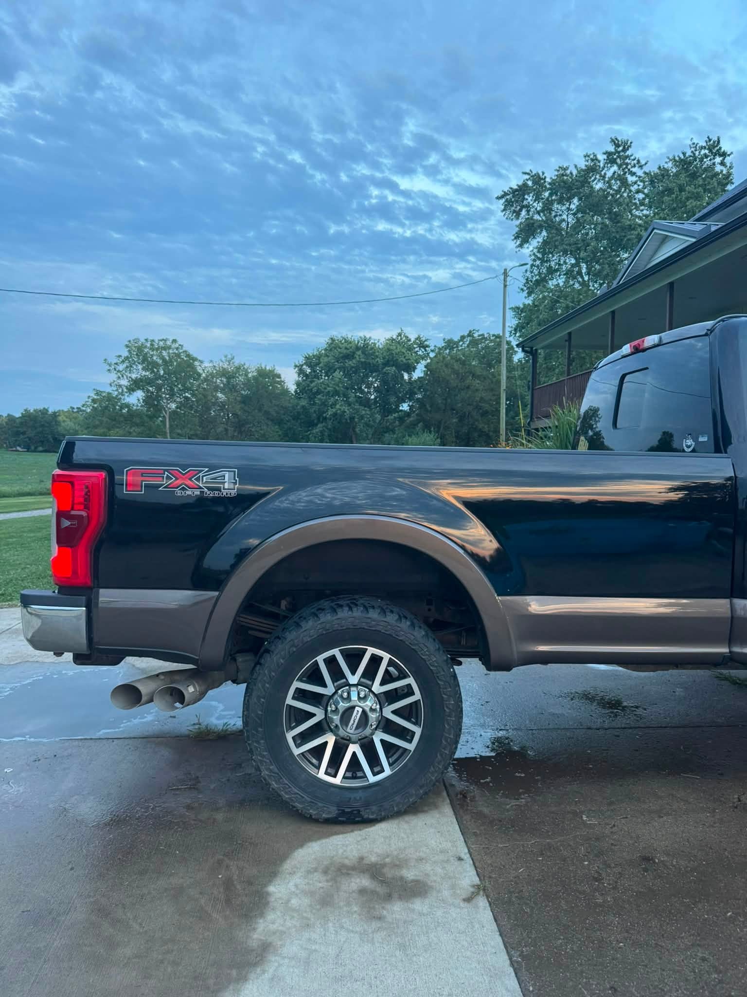 Side profile of a freshly washed black Super Duty truck